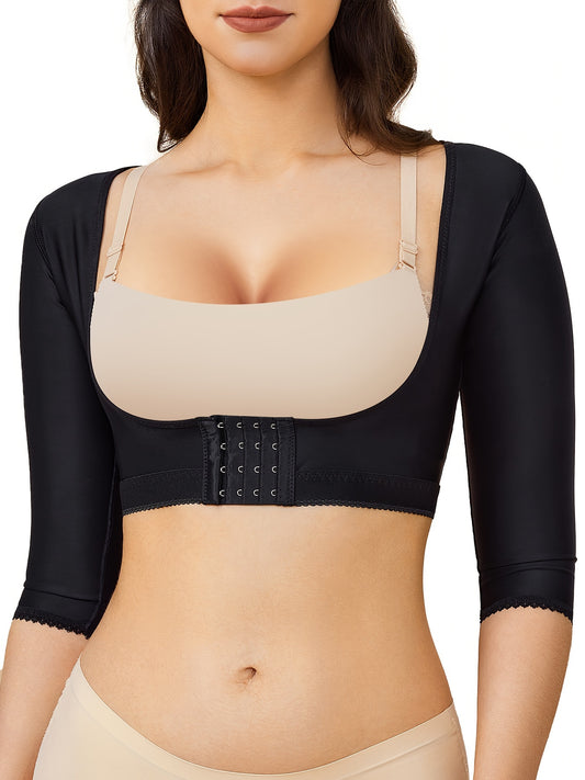 Black arm slimming shaping top for women with front hook closure and compression support.

