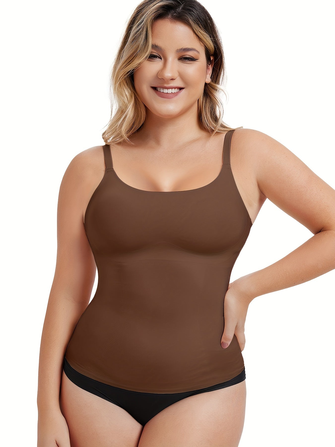 Black body contour tank with seamless structure and no-roll hem for sleek support.


