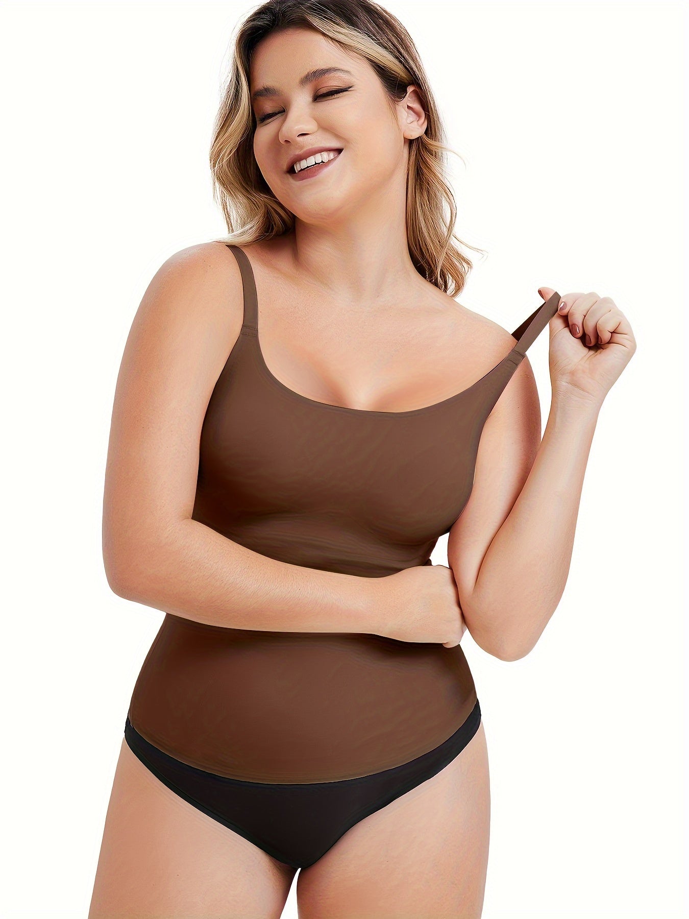 Wire-free compression tank for curvy women offering bust support and smooth lines.

