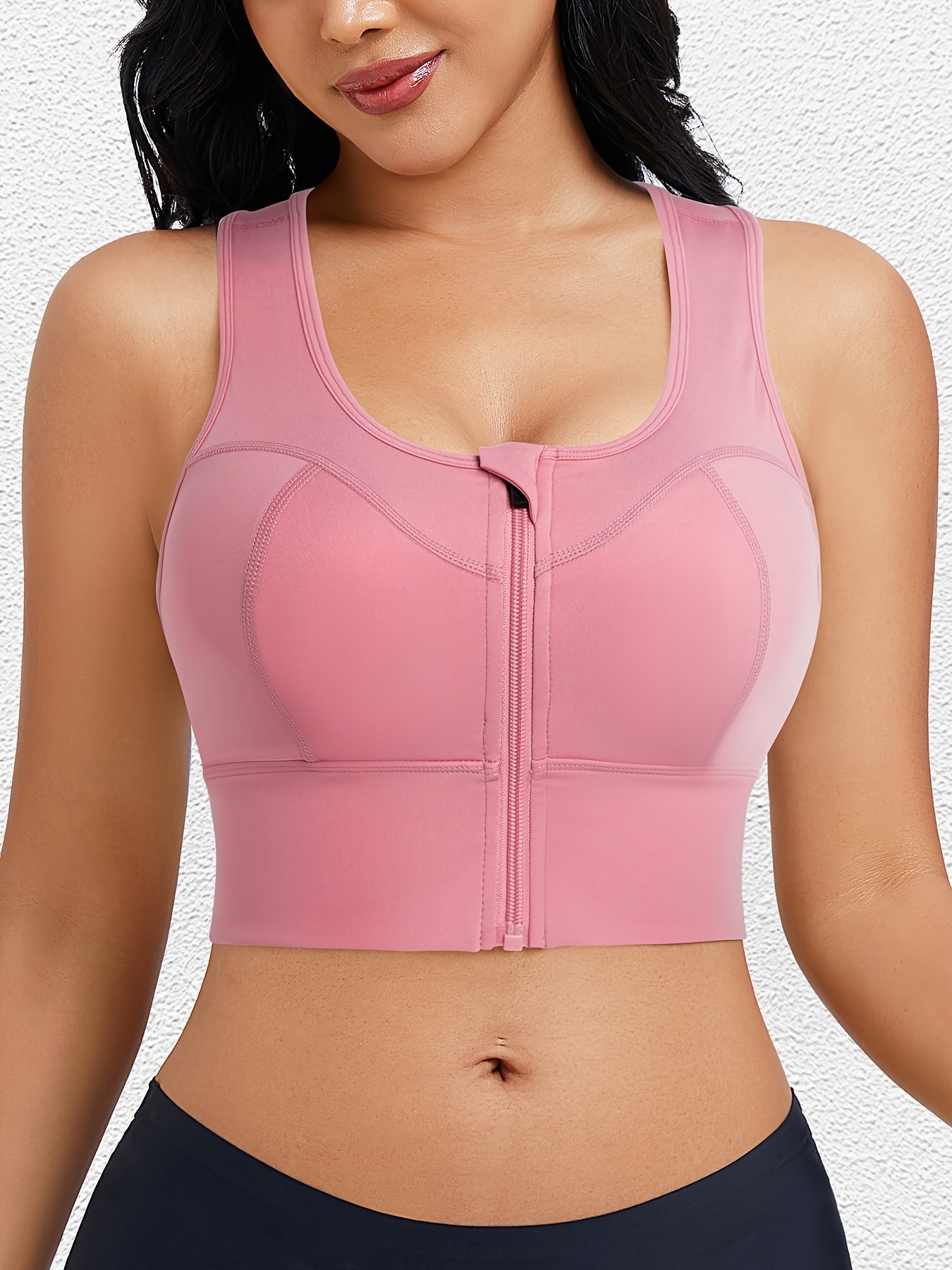 Sweatproof zipper bra with moisture-wicking fabric and breathable mesh lining.