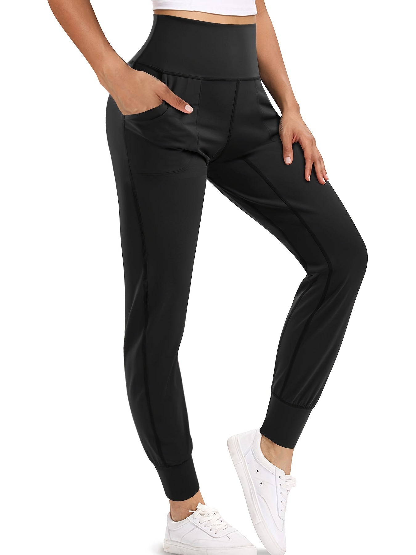 Black high waist tummy control pants for women with sculpting fit and smooth waistband.