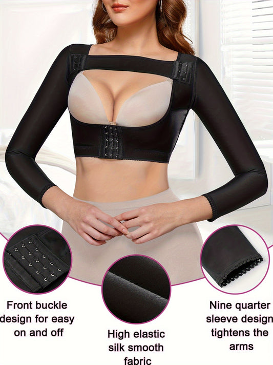 Long sleeve arm shaper top in black with compression fabric to smooth and slim upper body.

