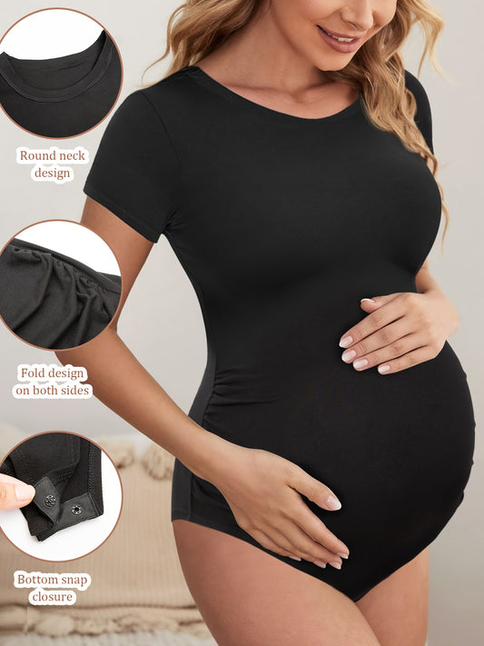 Black maternity short sleeve jumpsuit with soft stretch fabric and bump-hugging design.