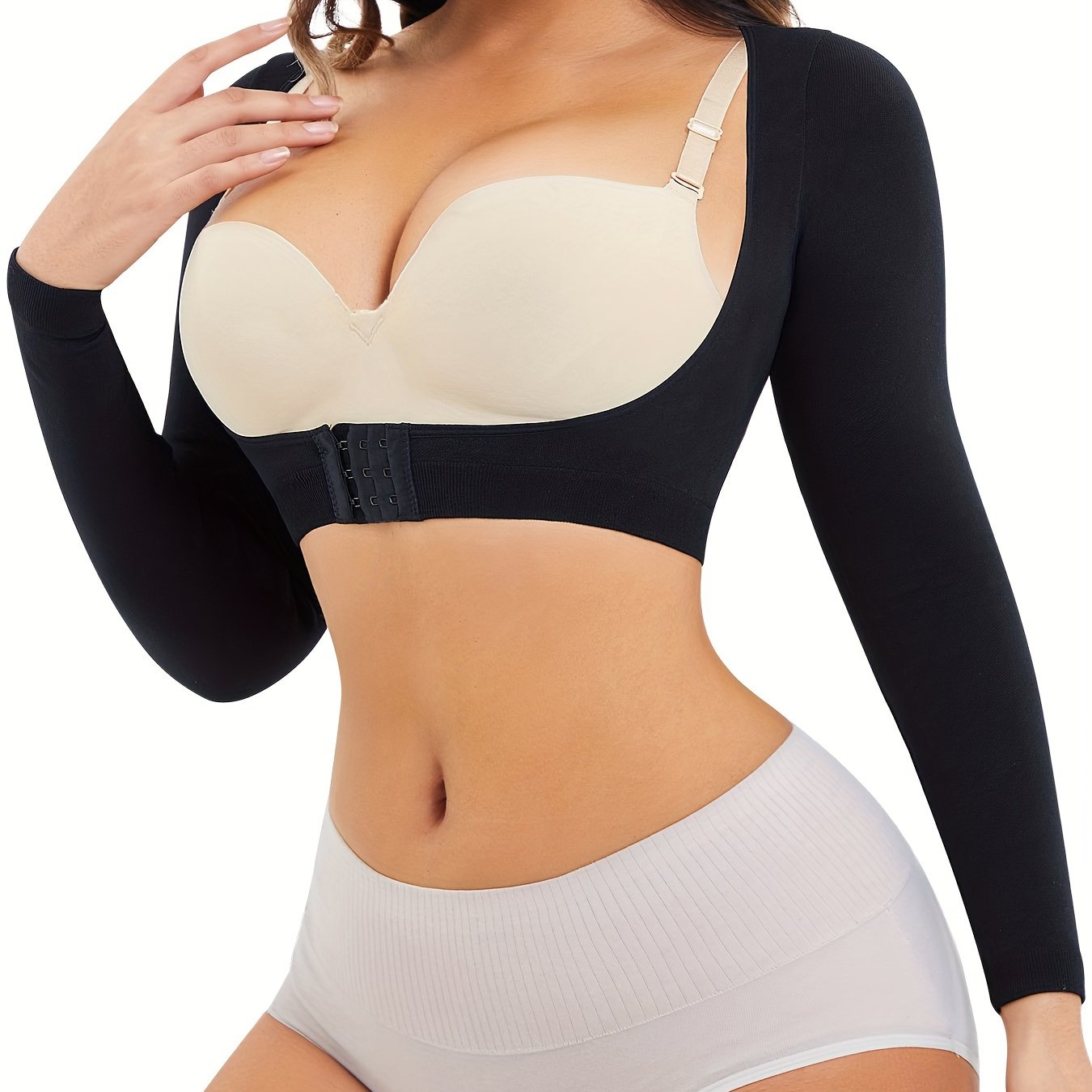 Bust-lifting push-up compression top with arm control and back smoothing for women.