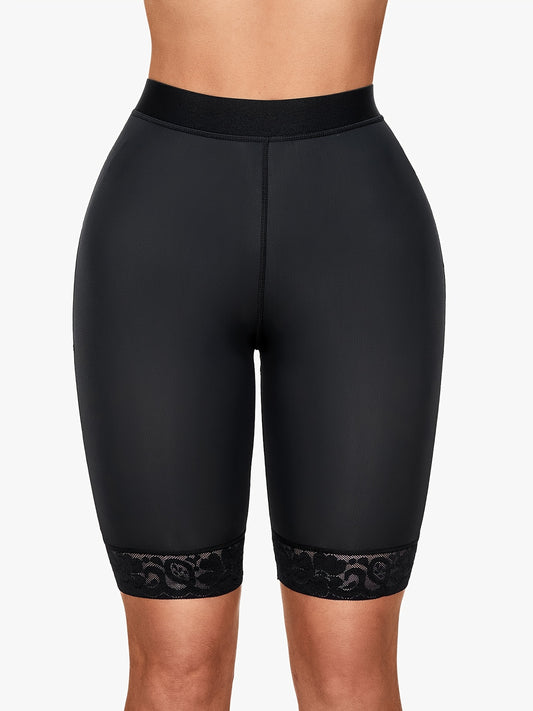 Seamless black sports shorts with elegant lace trim and supportive high waistband for stylish shaping.
