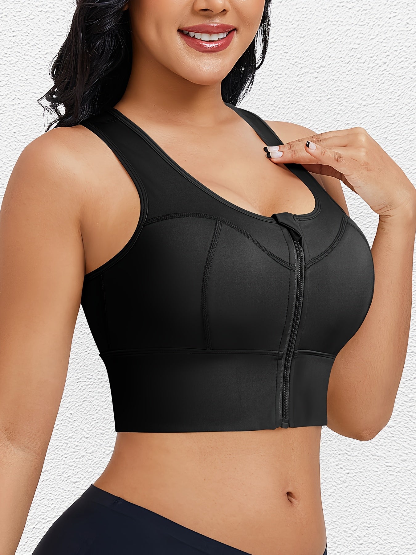 Yoga-ready sports bra with front zipper for easy wear and secure hold during movement.