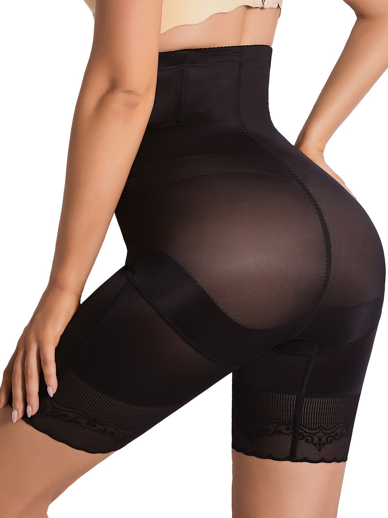 Zip front tummy tightening shaper shorts for secure fit and full coverage support.

