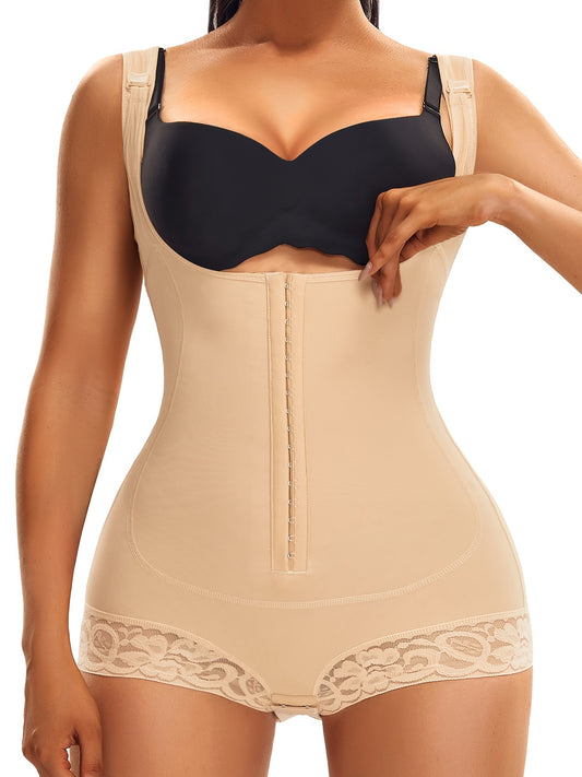 Nude zip front shaping bodysuit with lace leg trim and sculpting panels for curve control.

